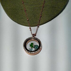 Women`s copper tone charms magnet closure necklace